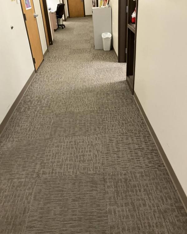 An office hallway with fresh carpet lines