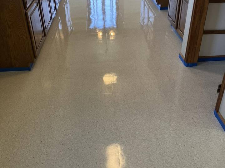 A glossy floor between kitchen counters