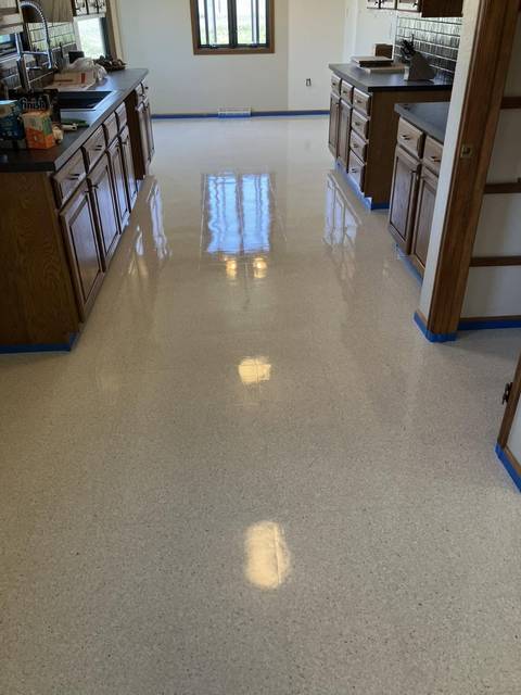 A glossy floor between kitchen counters