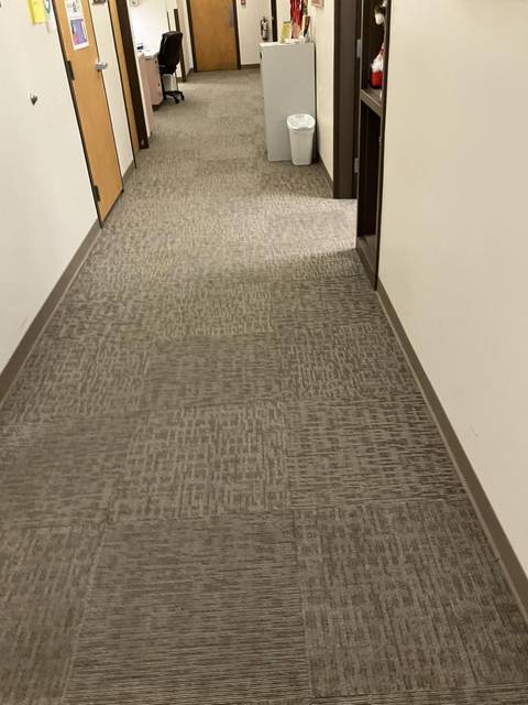 An office hallway with fresh carpet lines