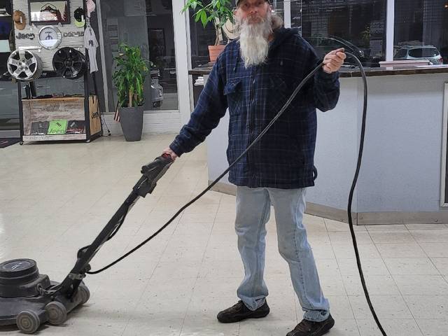 Running a floor buffer across a shop floor