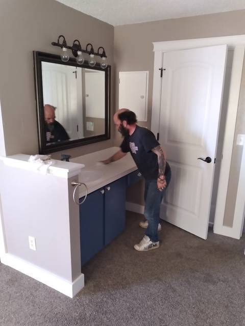 Wiping a bathroom vanity